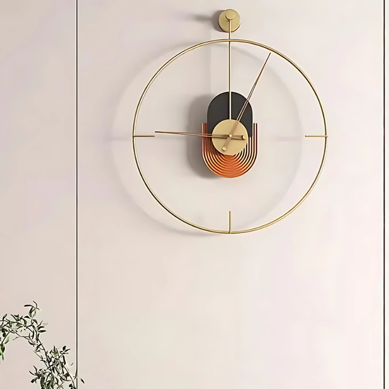 Horloge murale design cercle doré centre géométrique noir terracotta salon épuré